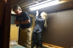 Michael and Kelley install footboard fasteners.