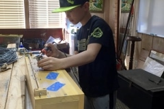 Oliver soldering on the chimney flute bass offset ches.t